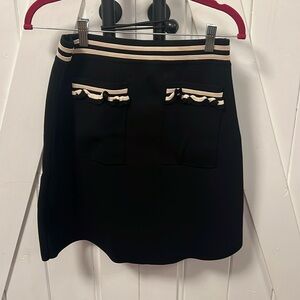 Sandro Paris black mini skirt with cream trim and front pockets size 2